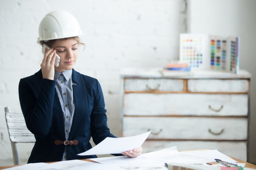 Homeowner reviewing documents and calling references while learning how to vet a contractor