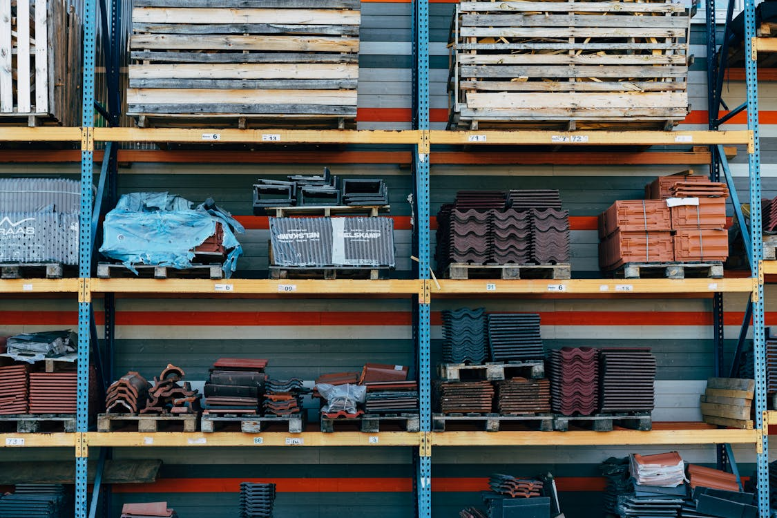 Stacked construction materials illustrating renovation supply chain delays and lead time planning