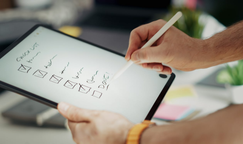 Homeowner completing post renovation walkthrough checklist before final payment