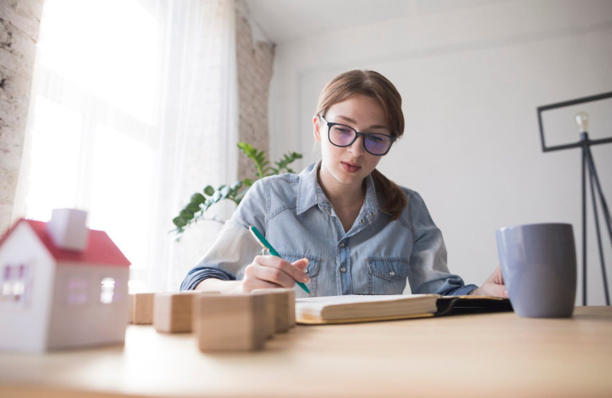Renovation contingency fund planning with homeowner reviewing costs.