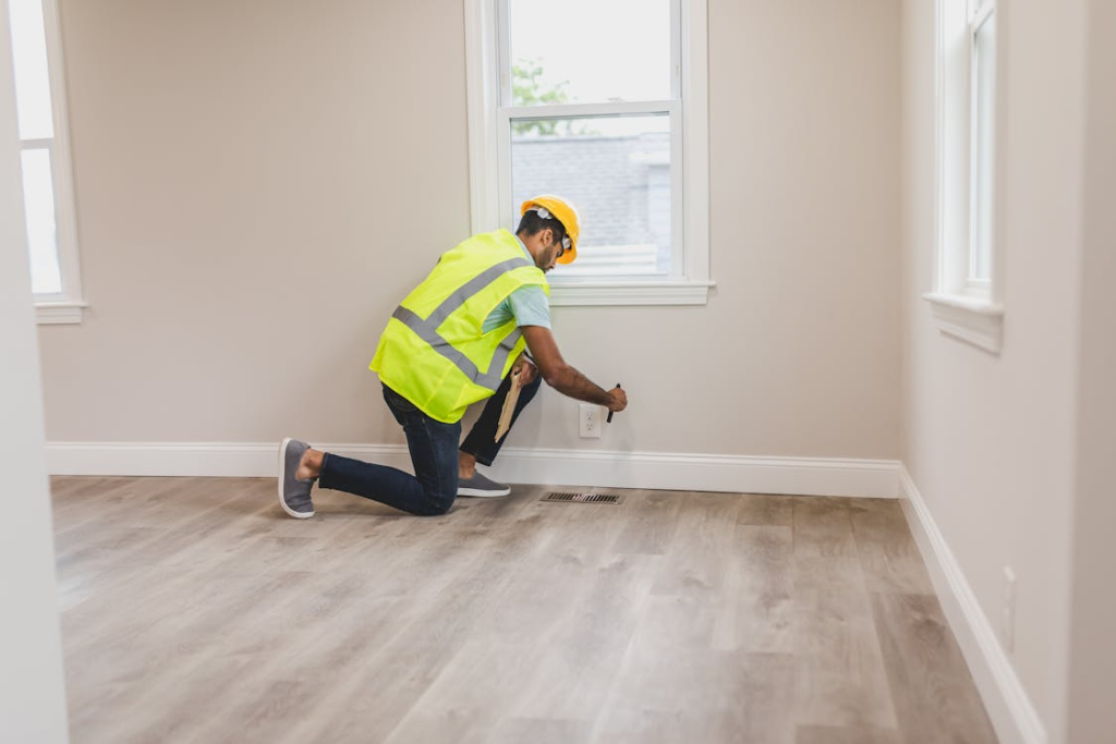 Contractor performing electrical check during pre-renovation home inspection checklist